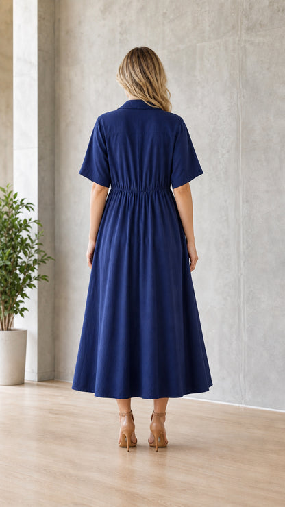 Woman wearing navy blue utility midi shirt dress from the back