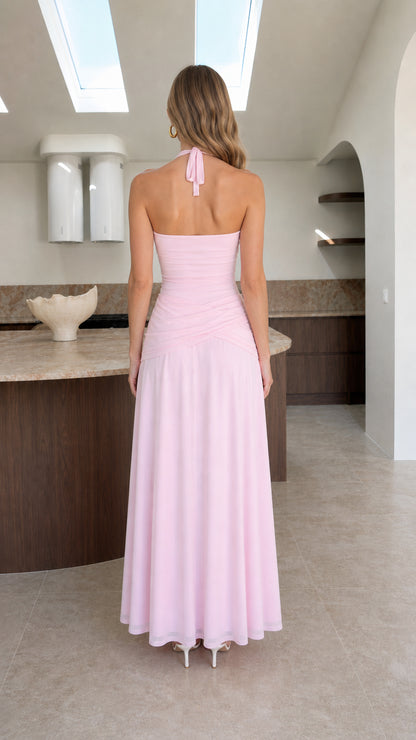 Back view of model showcasing halter neck ties on pink dress