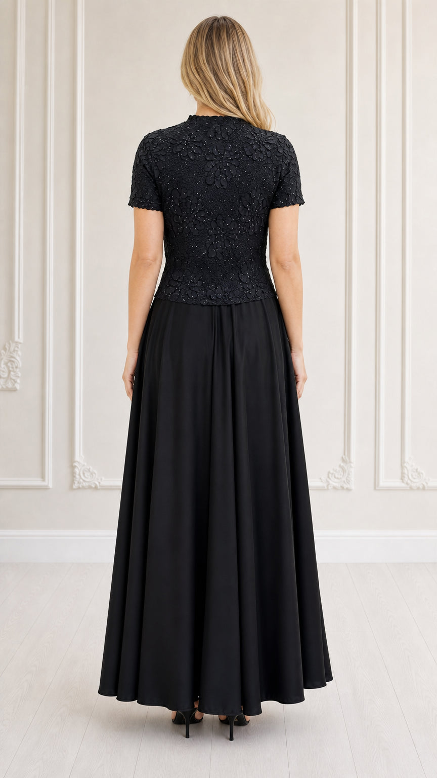 Back view of model in black evening dress