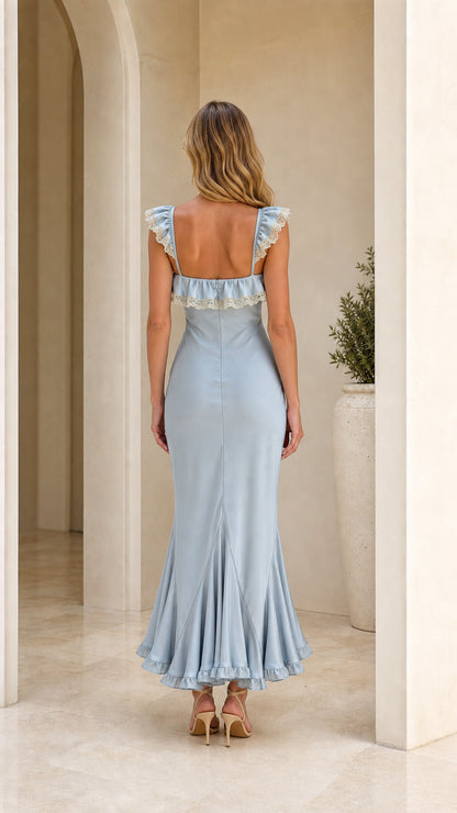 Model wearing light blue ruffle trim maxi dress back view