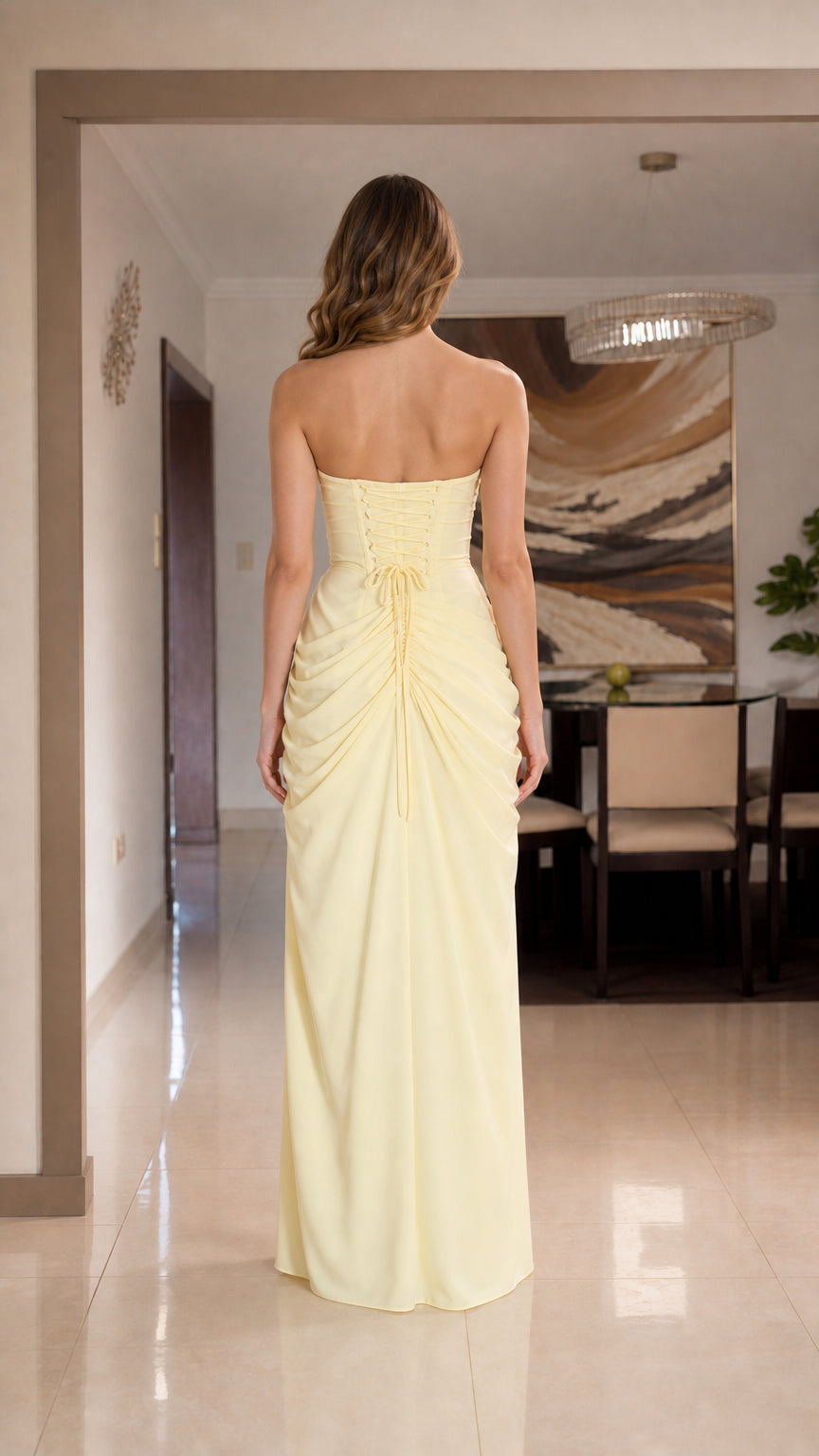 Back view of yellow strapless maxi dress with lace-up corset detail