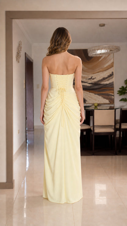 Back view of yellow strapless maxi dress with lace-up corset detail