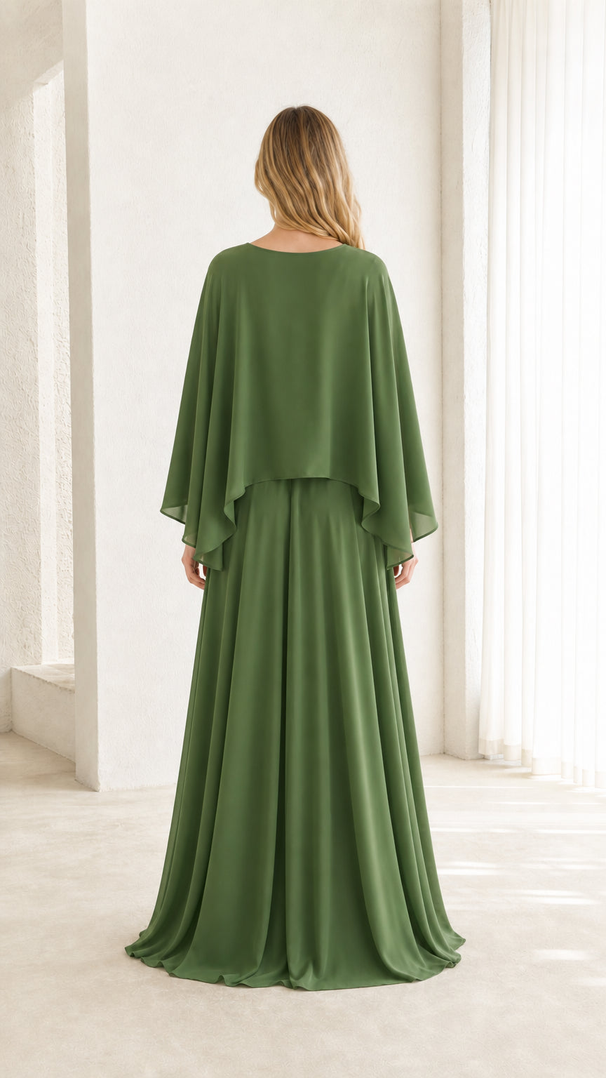 Back view showing flowing cape and skirt on olive green dress