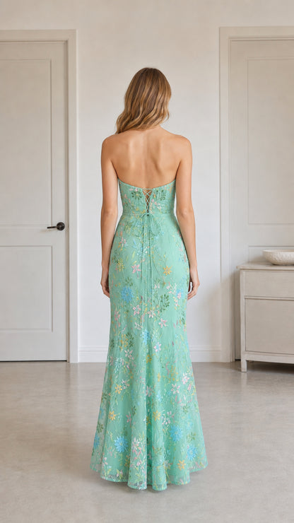 Back view of mint green dress highlighting corset lace-up detail