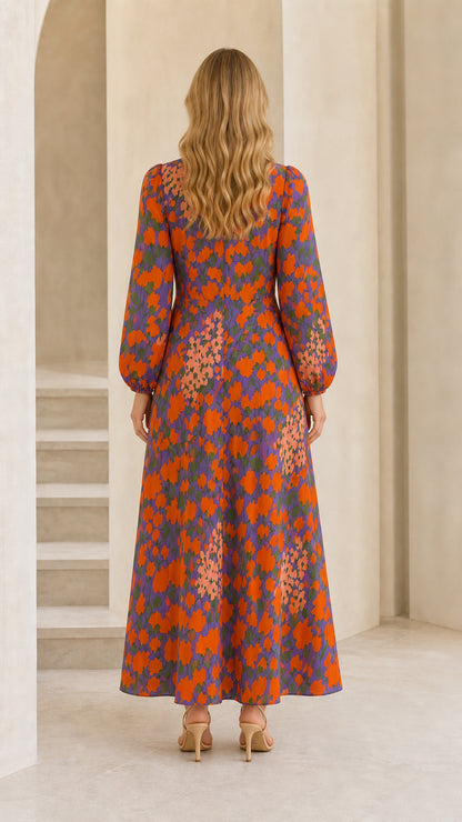 Back view of model wearing purple floral long sleeve maxi dress