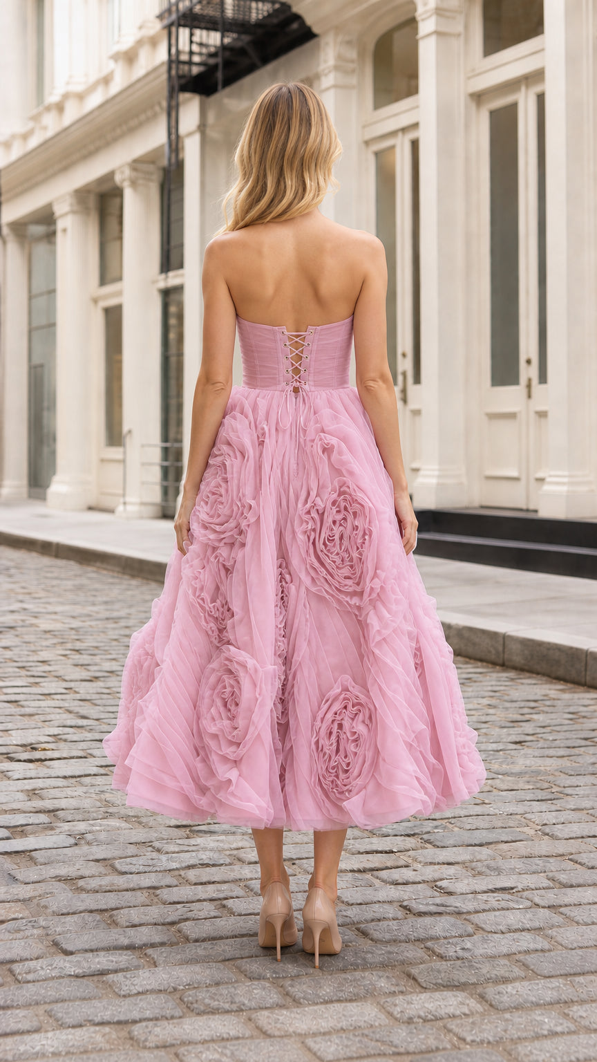 Back view showing corset lace-up detail on pink midi dress