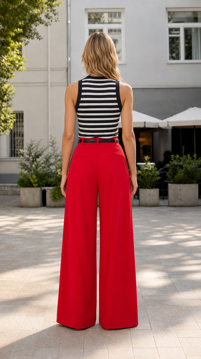 Back view of model wearing red wide-leg trousers