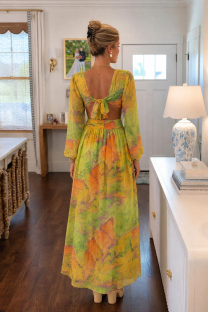 Back view showing tie-back detail on yellow multi dress