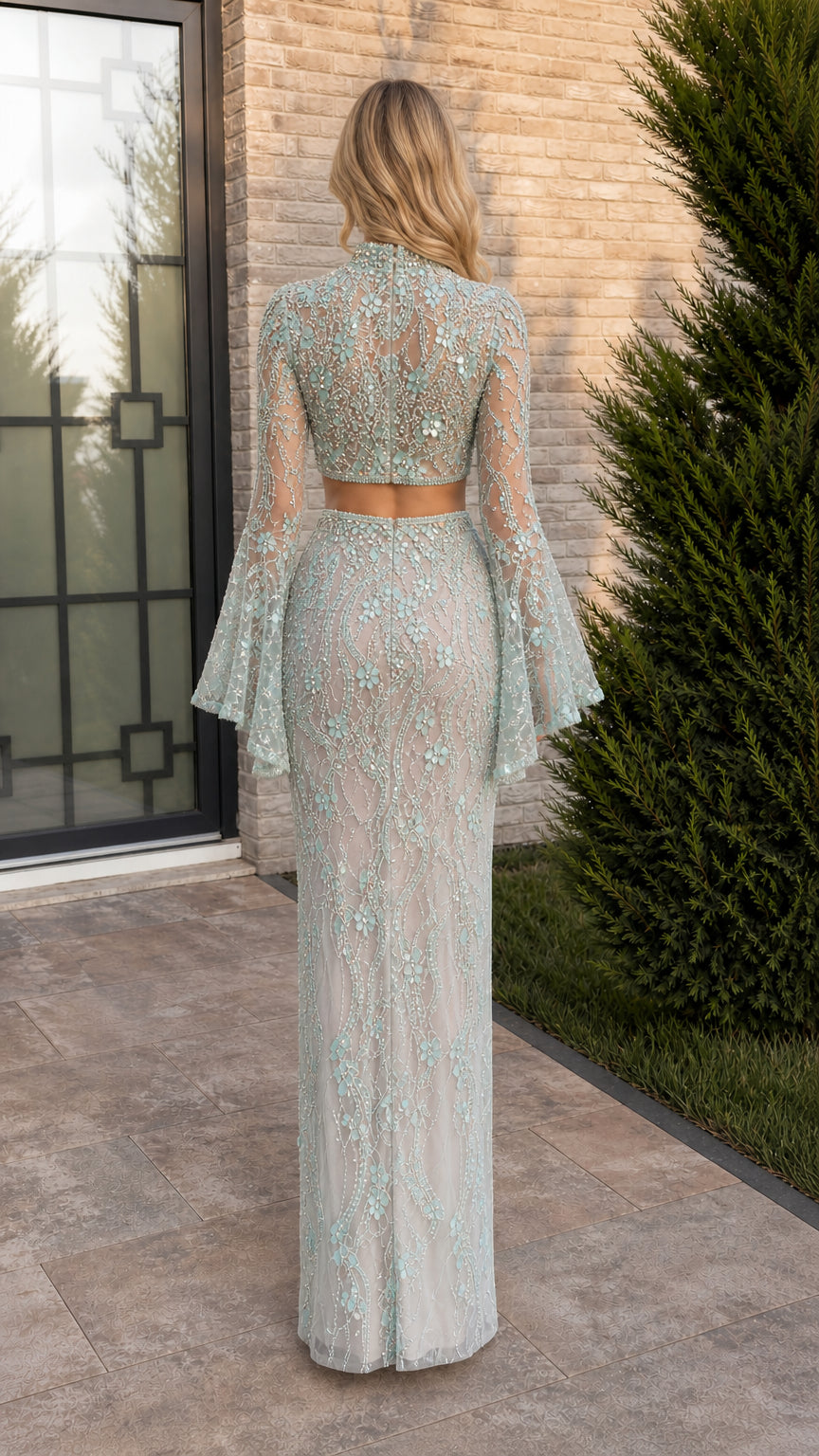 Back view of sage green bell sleeve crop top and skirt