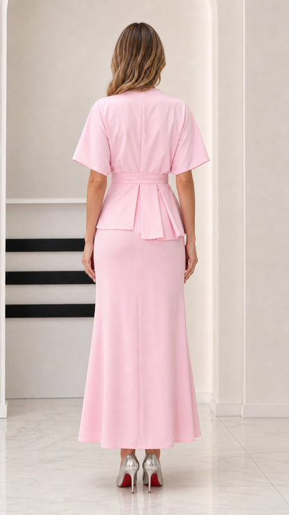 Back view of model showing smooth back design of Light Pink maxi dress