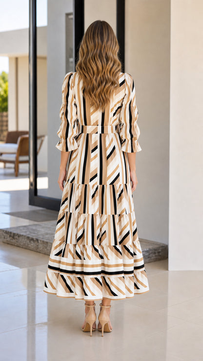 Back view of woman in beige striped tiered dress
