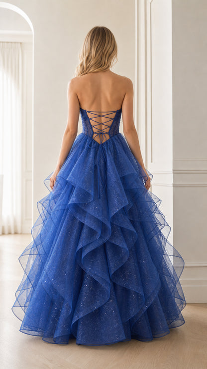 Back view of royal blue gown showcasing the lace-up corset back