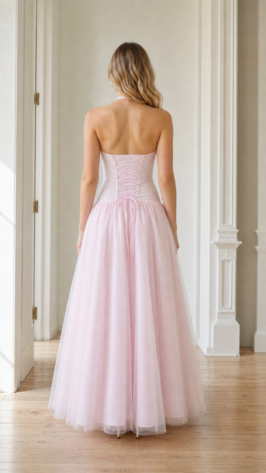 Back view showing the corset lacing detail on the pink gown