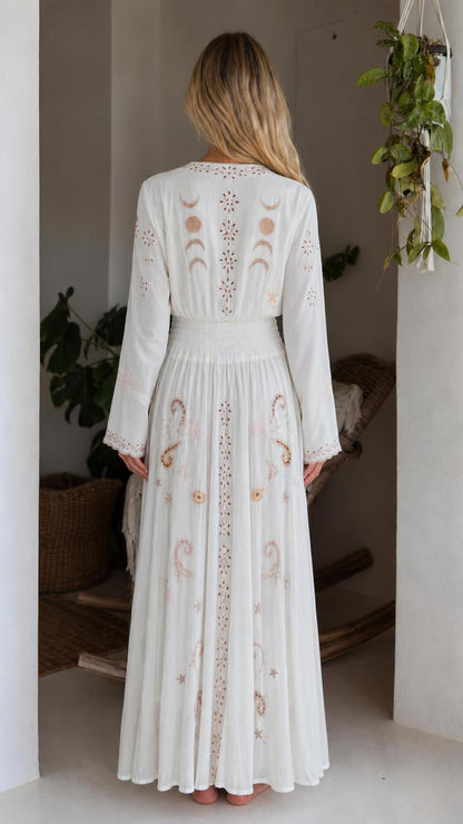 Back view of white bohemian celestial maxi dress