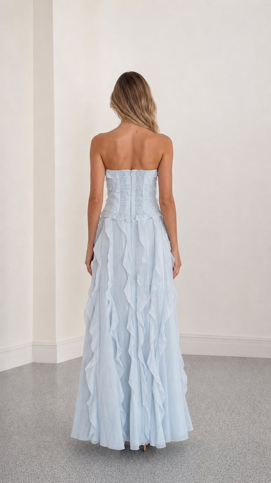 Back view showing structured bodice of light blue gown