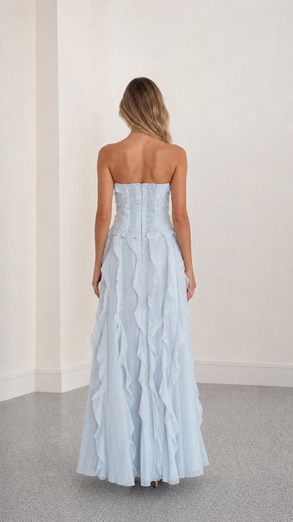 Back view showing structured bodice of light blue gown