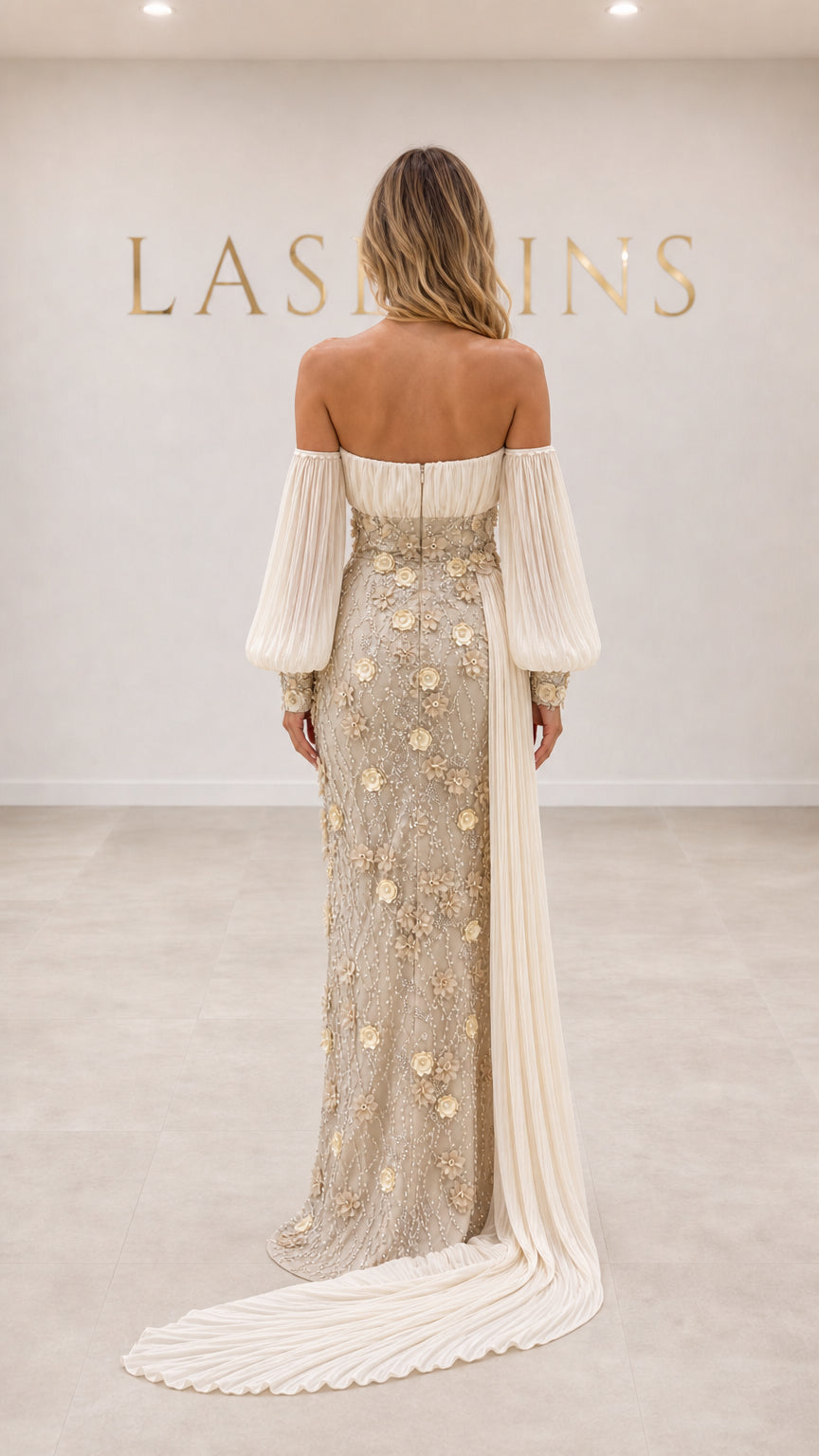 Back view of off-the-shoulder champagne formal evening dress showing train detail