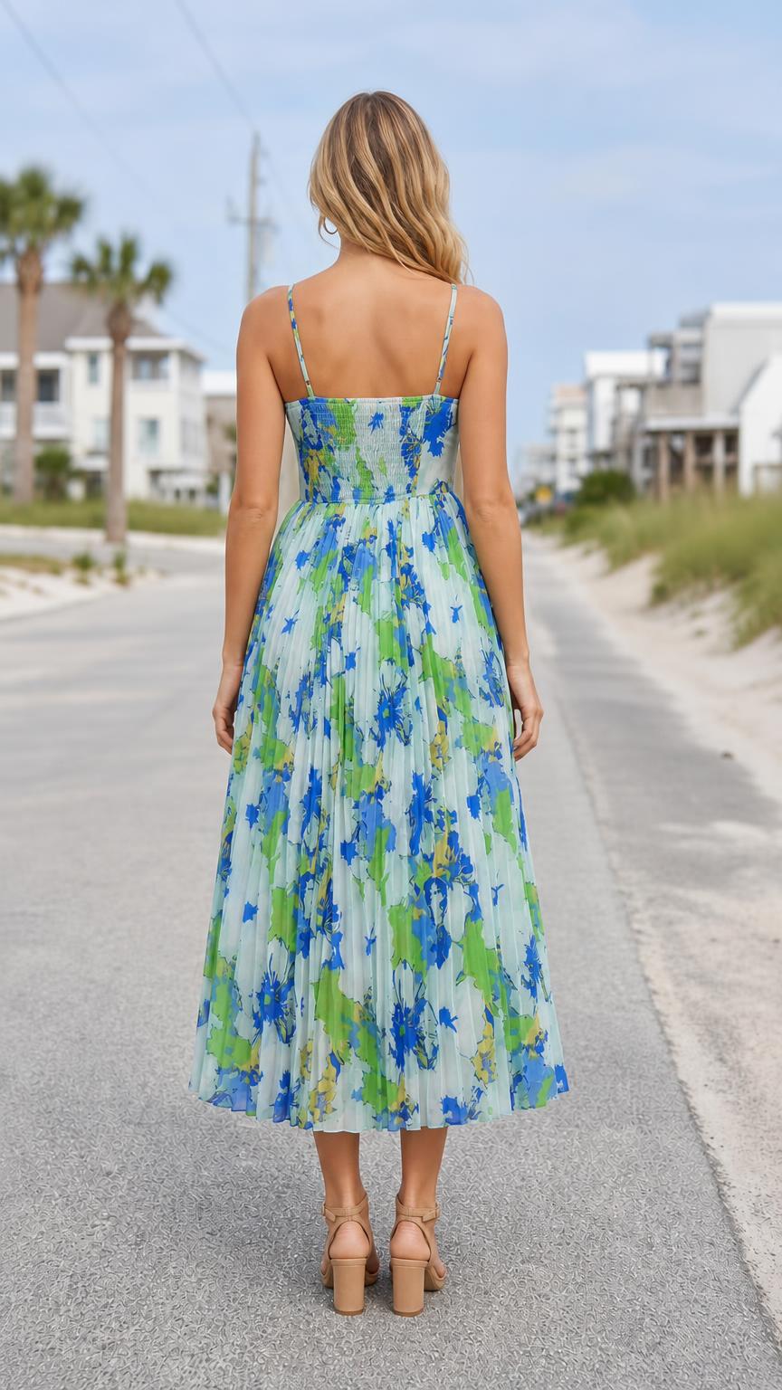 Back view of model showing smocked back detail of floral midi dress
