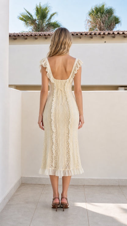 Back view showing scoop back of ivory midi dress