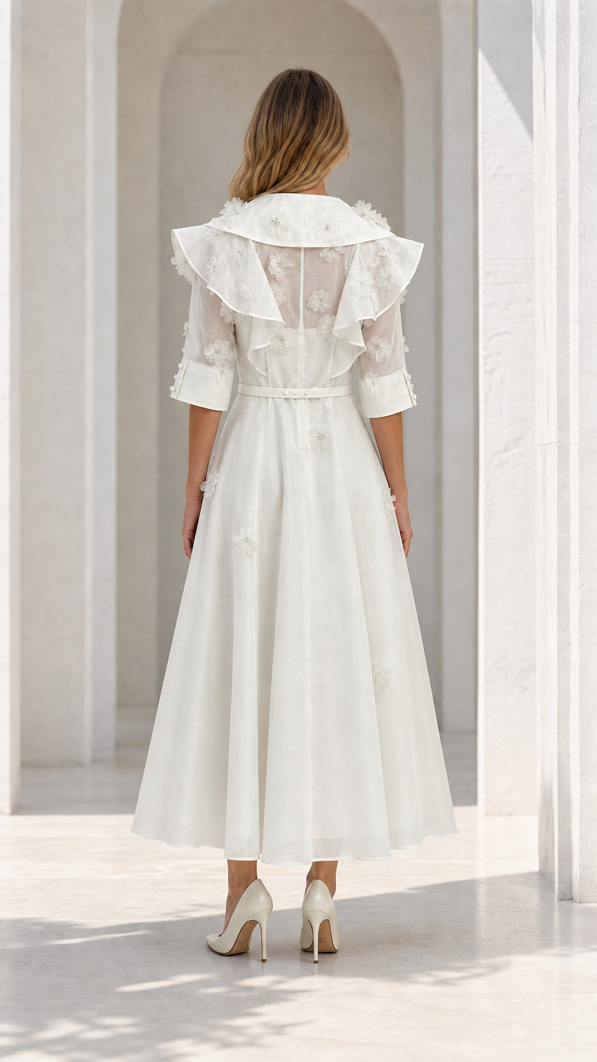 Back view of model in white dress