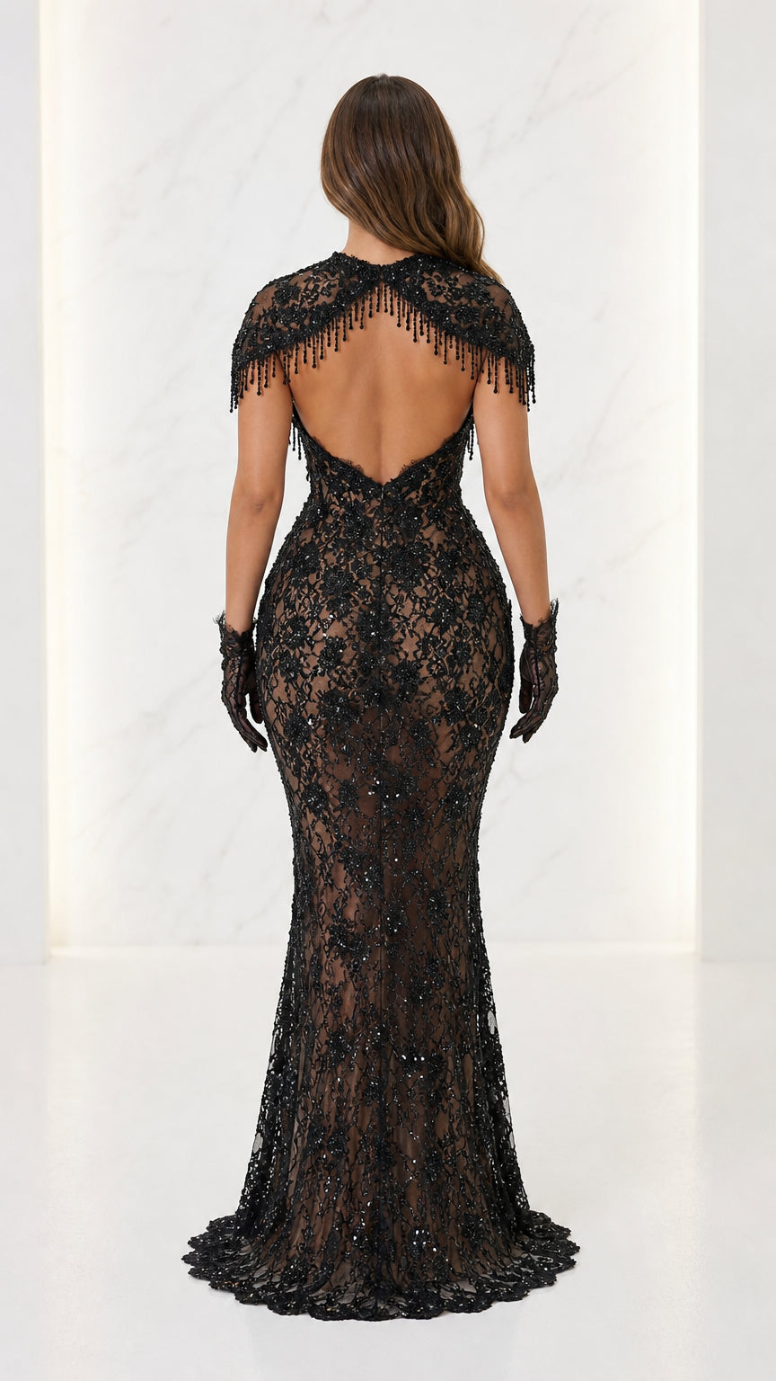 Back view showing open back detail of black gown