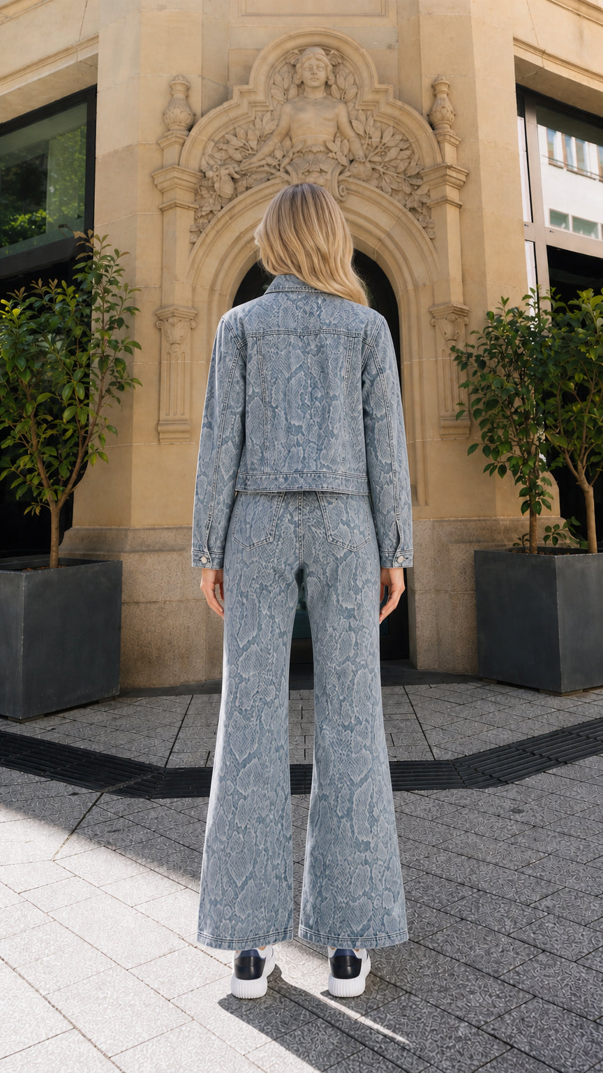 Full back view of model wearing blue snake print denim set