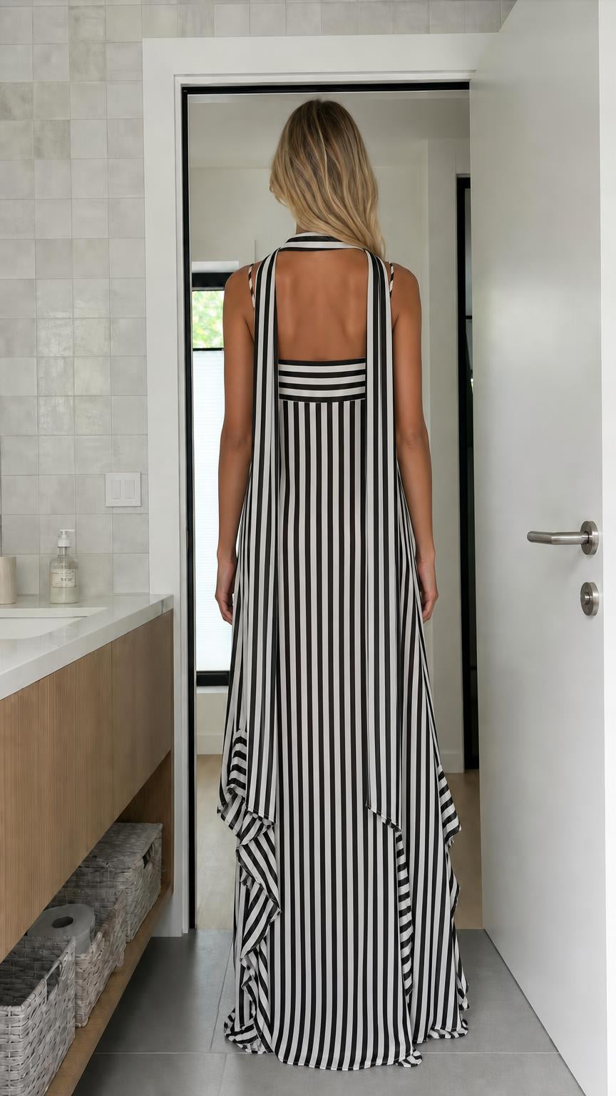 Back view of black and white striped maxi dress showing strap details
