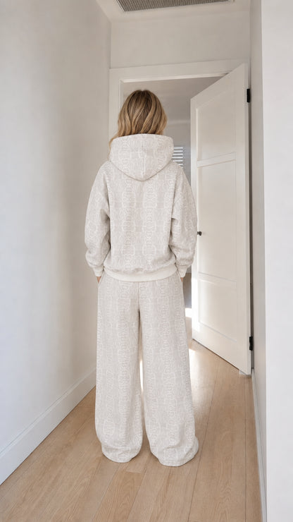 Back view of off-white hoodie and wide-leg pants set
