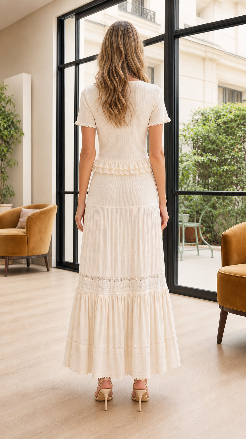 Back view of model wearing cream short sleeve matching maxi skirt set