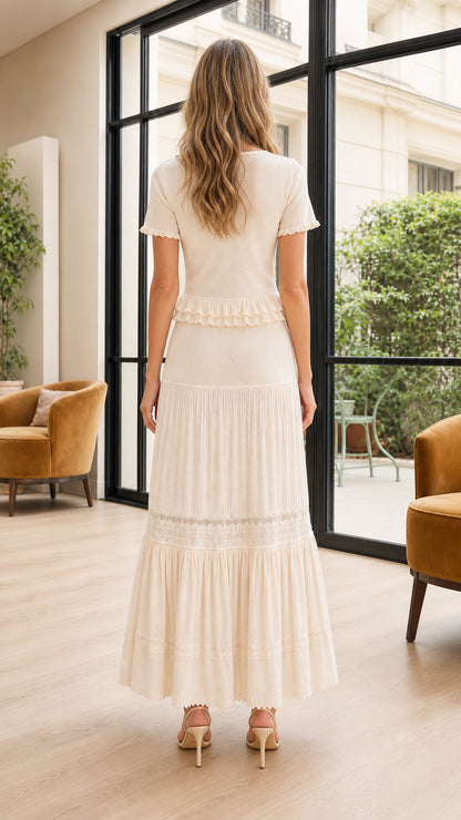 Back view of model wearing cream short sleeve matching maxi skirt set