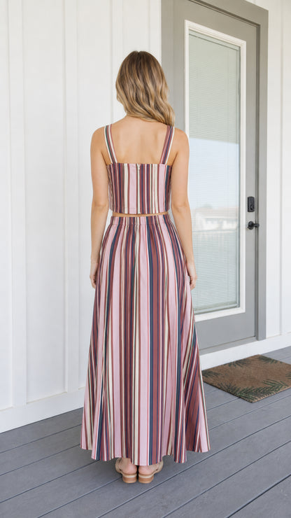 Back view of woman wearing pink striped two-piece set