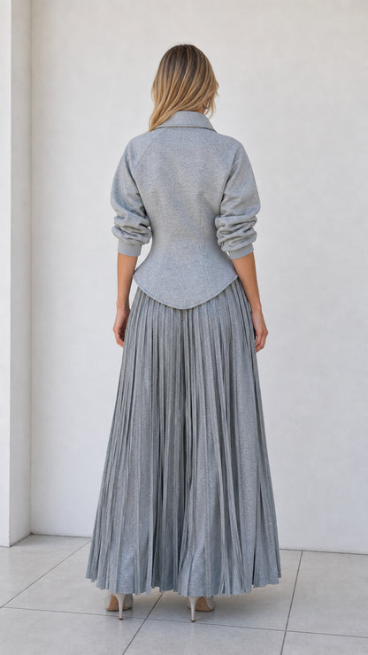 Back view of model wearing heather grey structured jacket top and flowy wide-leg pants