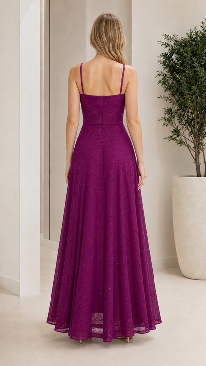 Back view of model in purple sparkle maxi dress