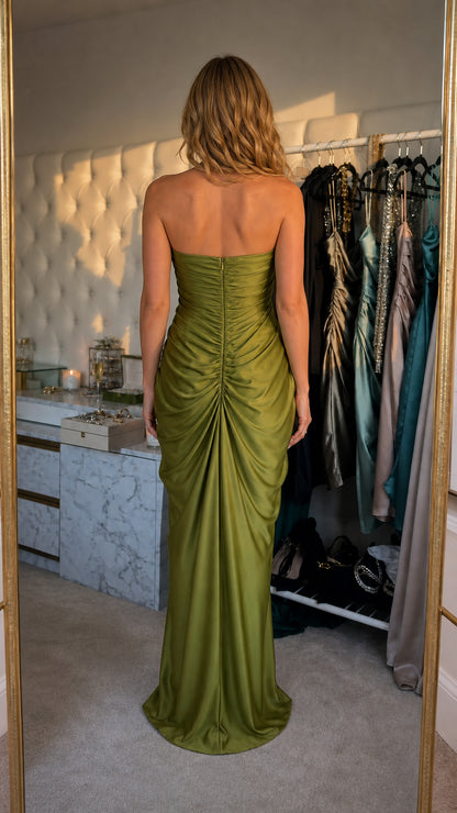 Model wearing olive satin strapless evening dress back view