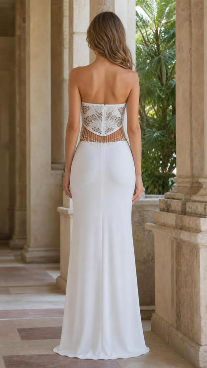 Back view of white strapless evening gown showing detailed beaded bodice