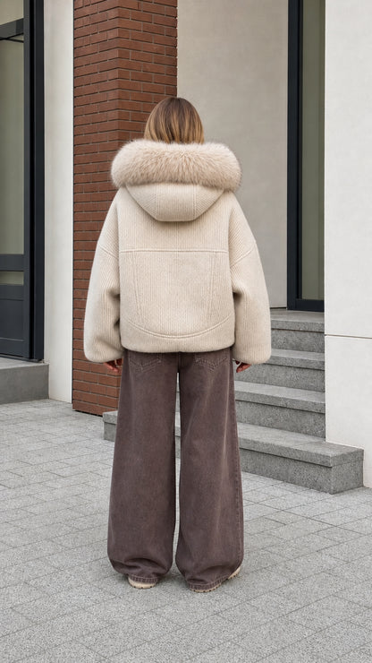 Back view of cream textured ribbed bomber jacket showing full faux fur hood