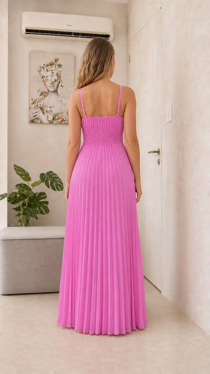 Back view of model in fuchsia pleated maxi dress
