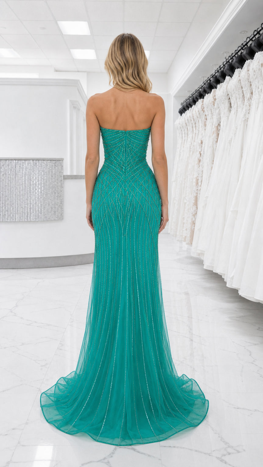 Back view of teal strapless formal gown