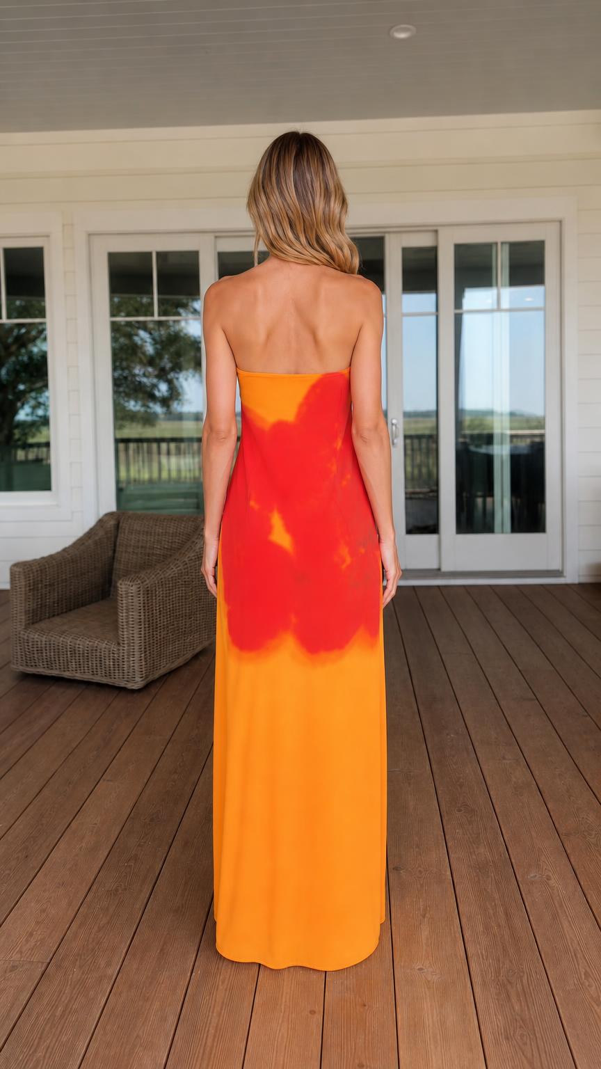 Back view of woman in orange maxi dress
