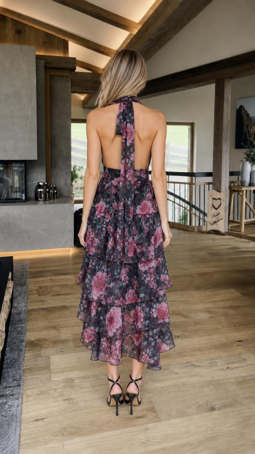 Back view showcasing open back design of black floral dress