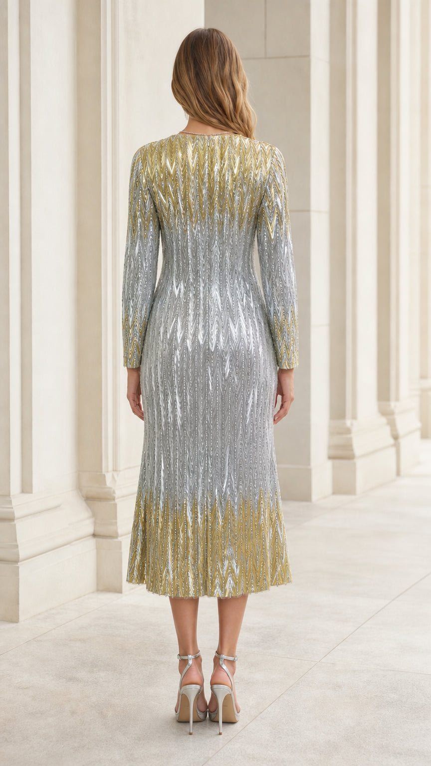 Back view of woman wearing silver and gold sequin long sleeve midi dress