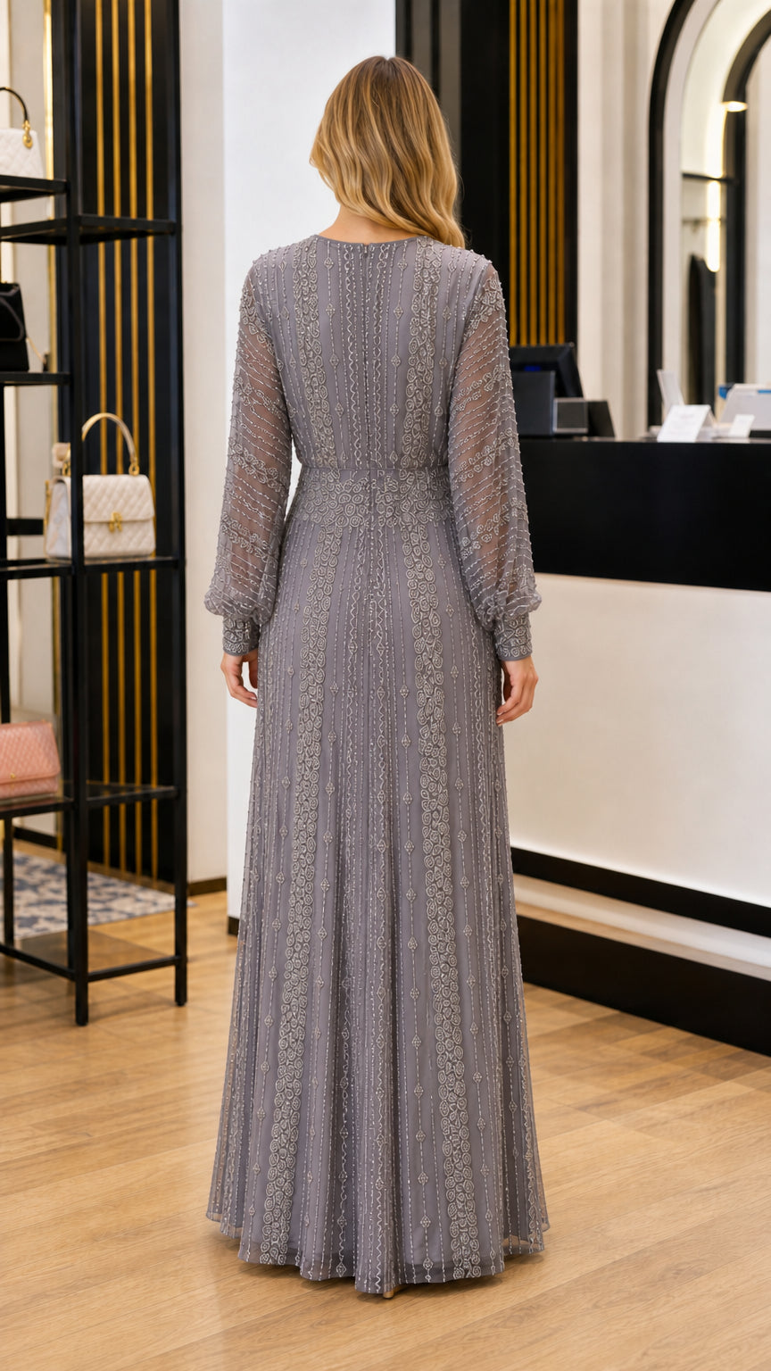 Back view of slate grey floor-length evening gown with long sleeves