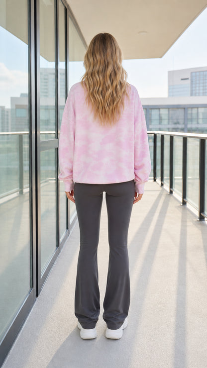 Back view of woman wearing pink tie-dye waffle thermal sweatshirt