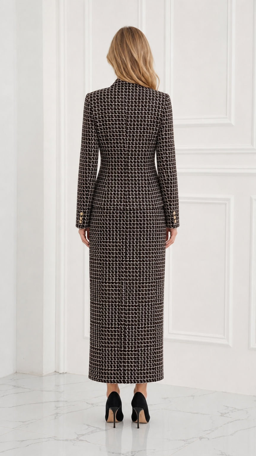 Back view of model wearing black woven tweed skirt suit set