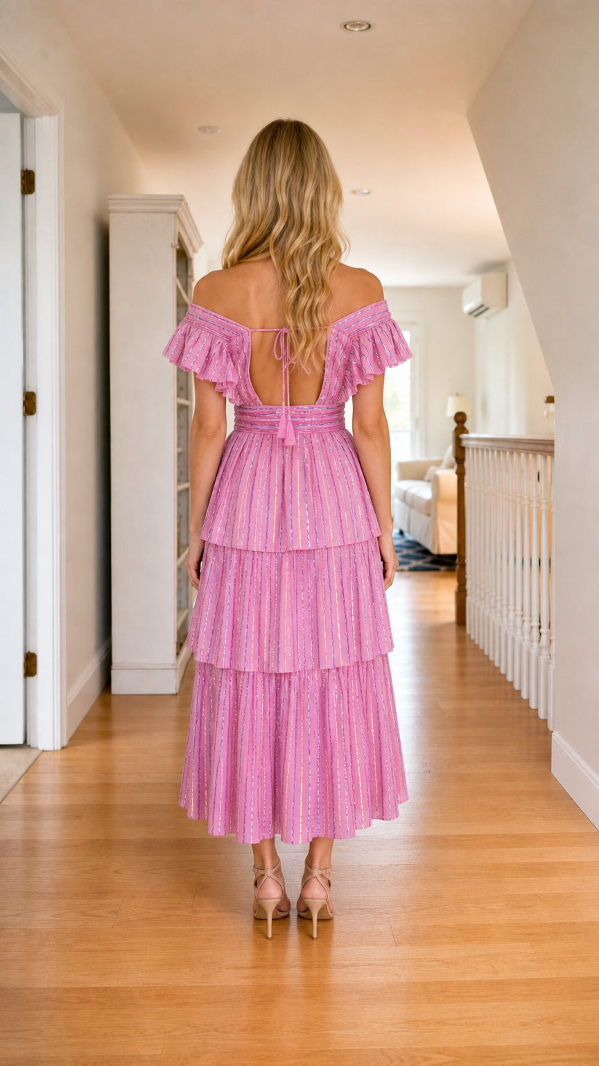 Back view of pink off-shoulder ruffle tiered midi dress showing back cutout and tie detail