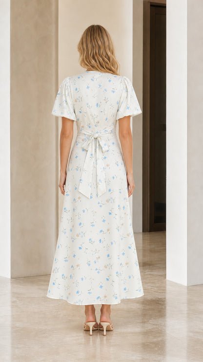 Back view showing bow detail on white floral print maxi dress