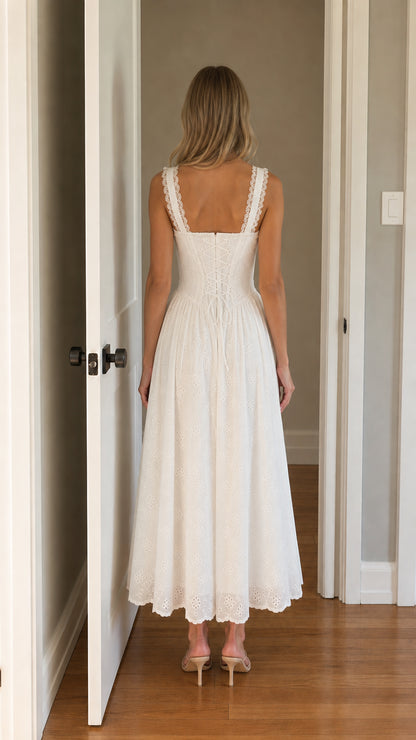 Back view of woman wearing white square neck eyelet midi dress