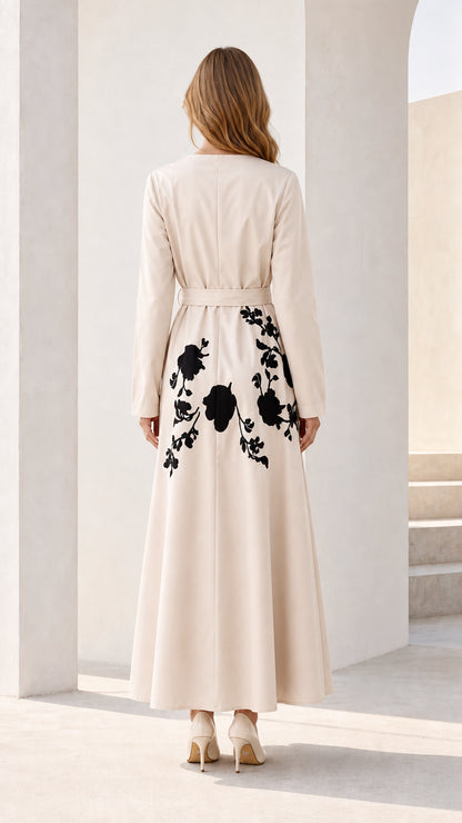 Back view showcasing floral embroidery on beige maxi dress