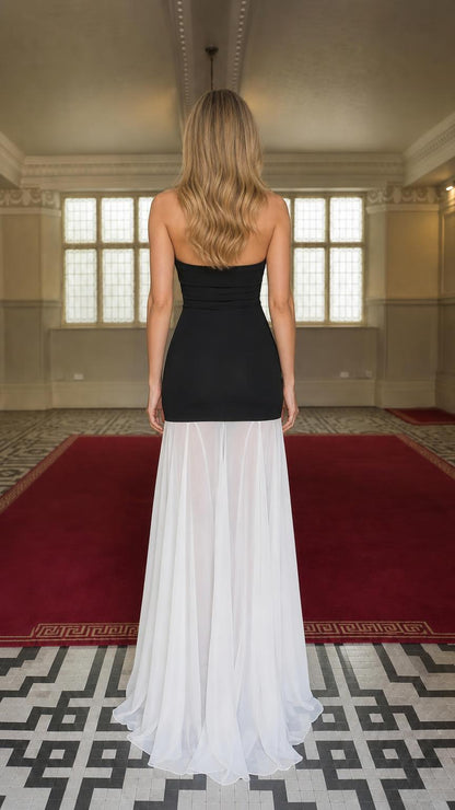 Back view of model showcasing sheer chiffon skirt detail