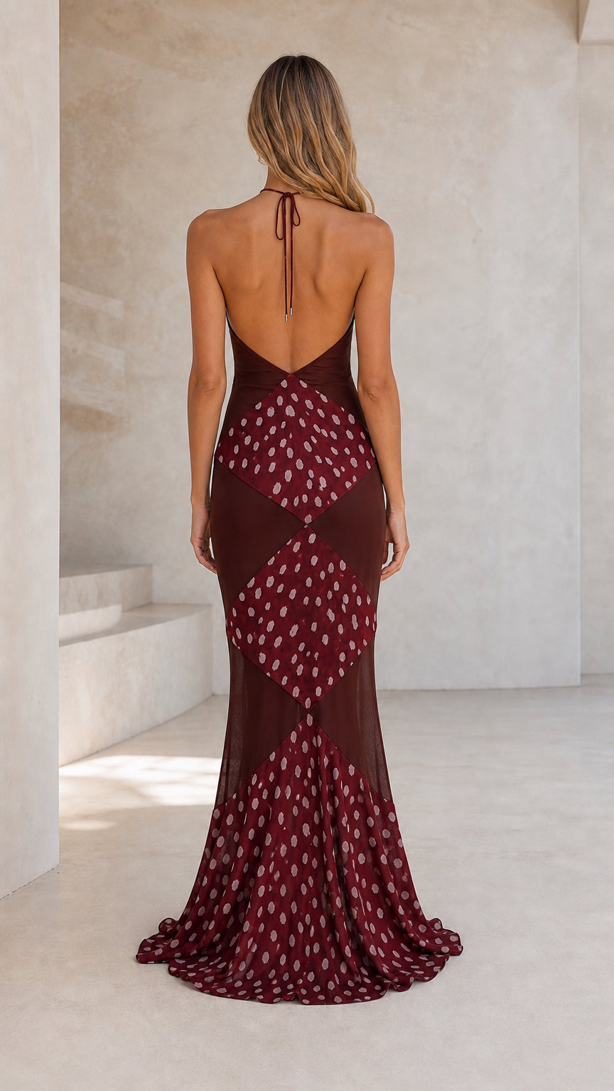 Back view showcasing open back and tie detail of burgundy dress